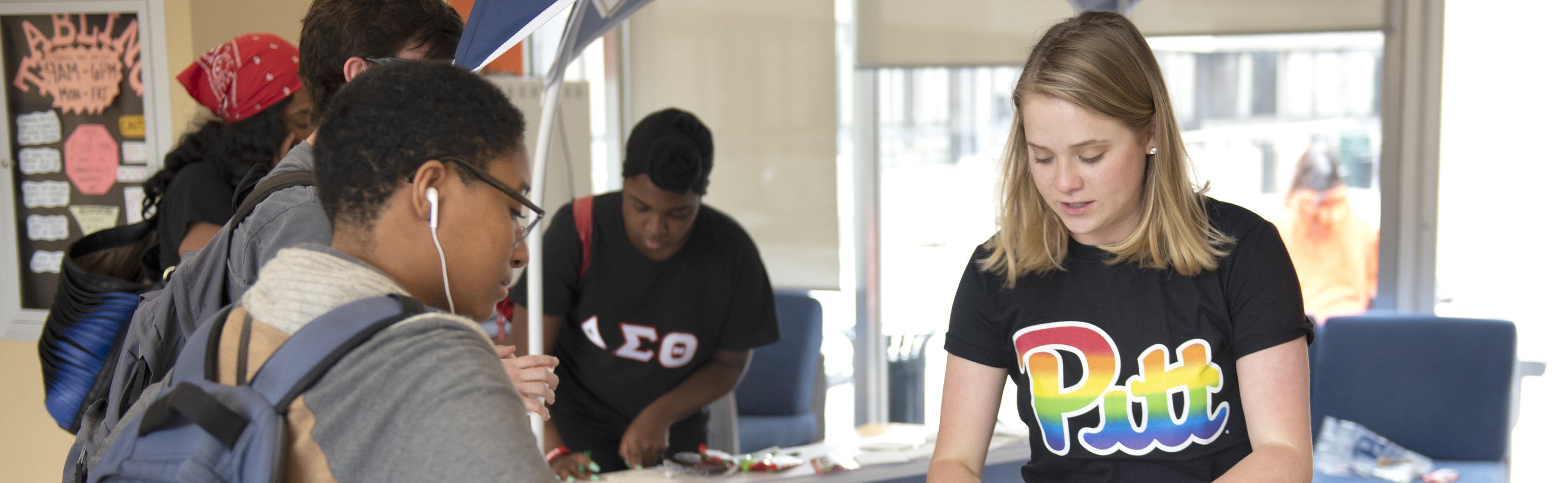Students visit tabling event during Pride